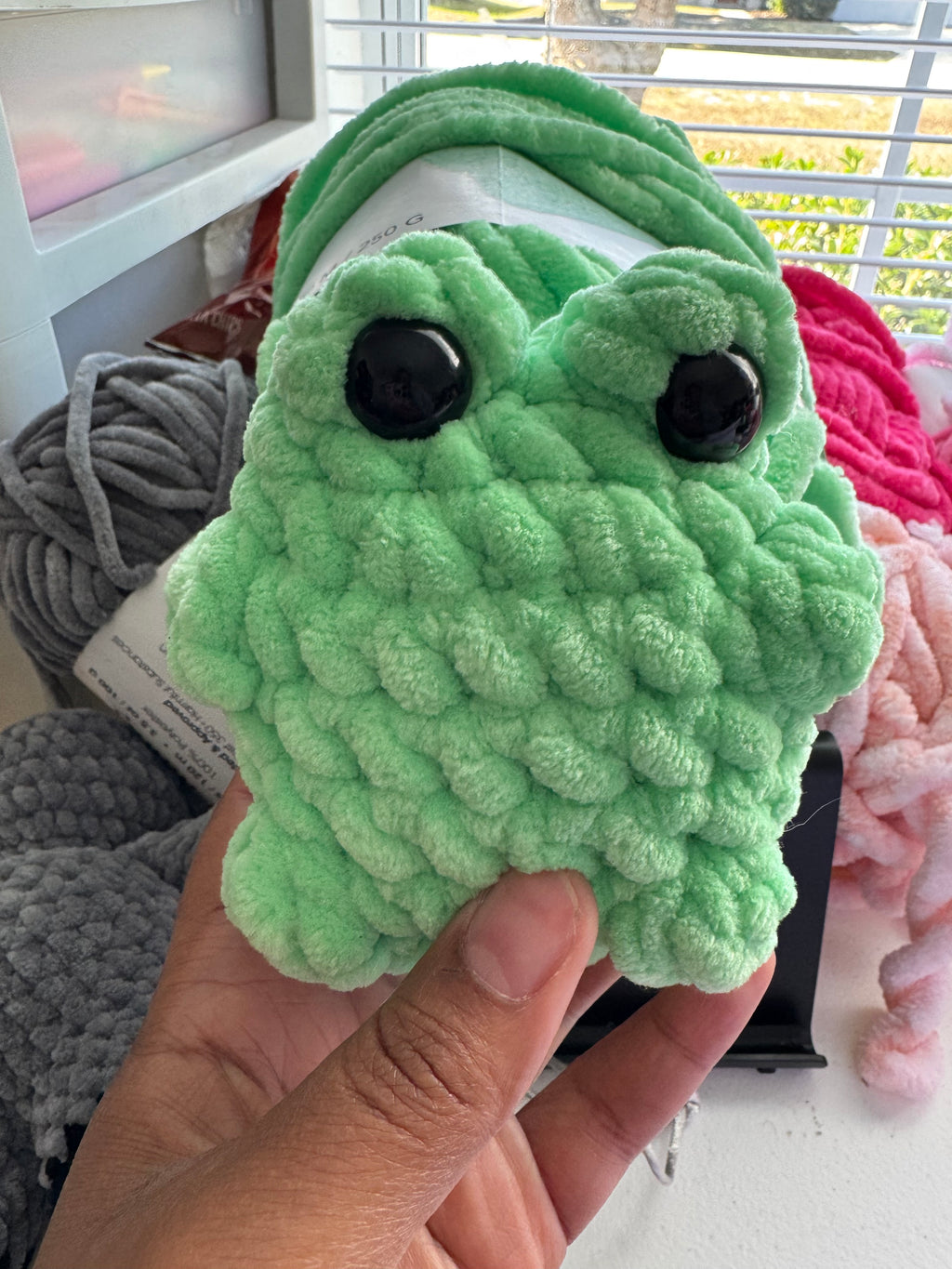 Hand-crocheted frog