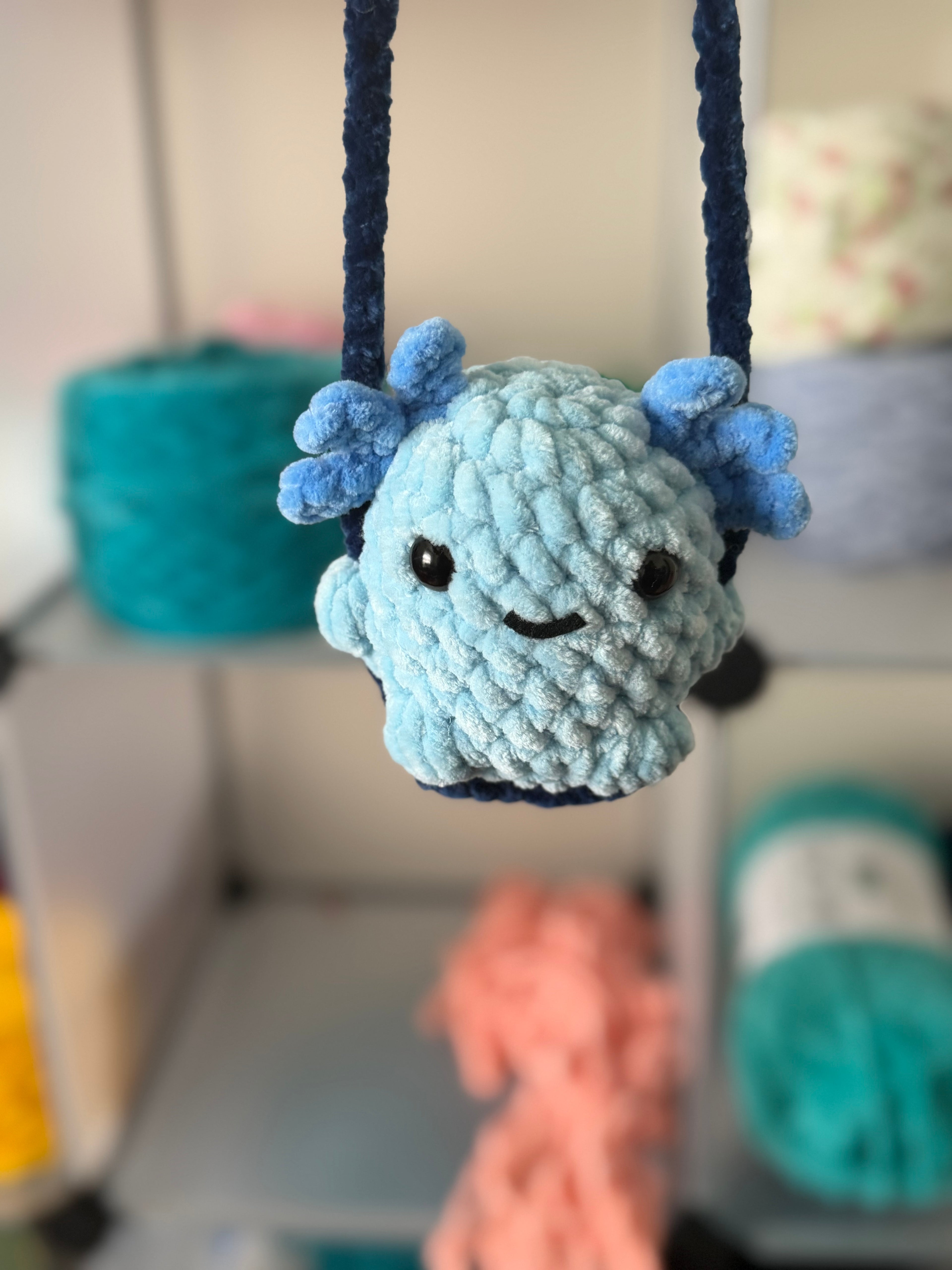 Blue axolotl car swing