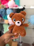 Brown bear with pink