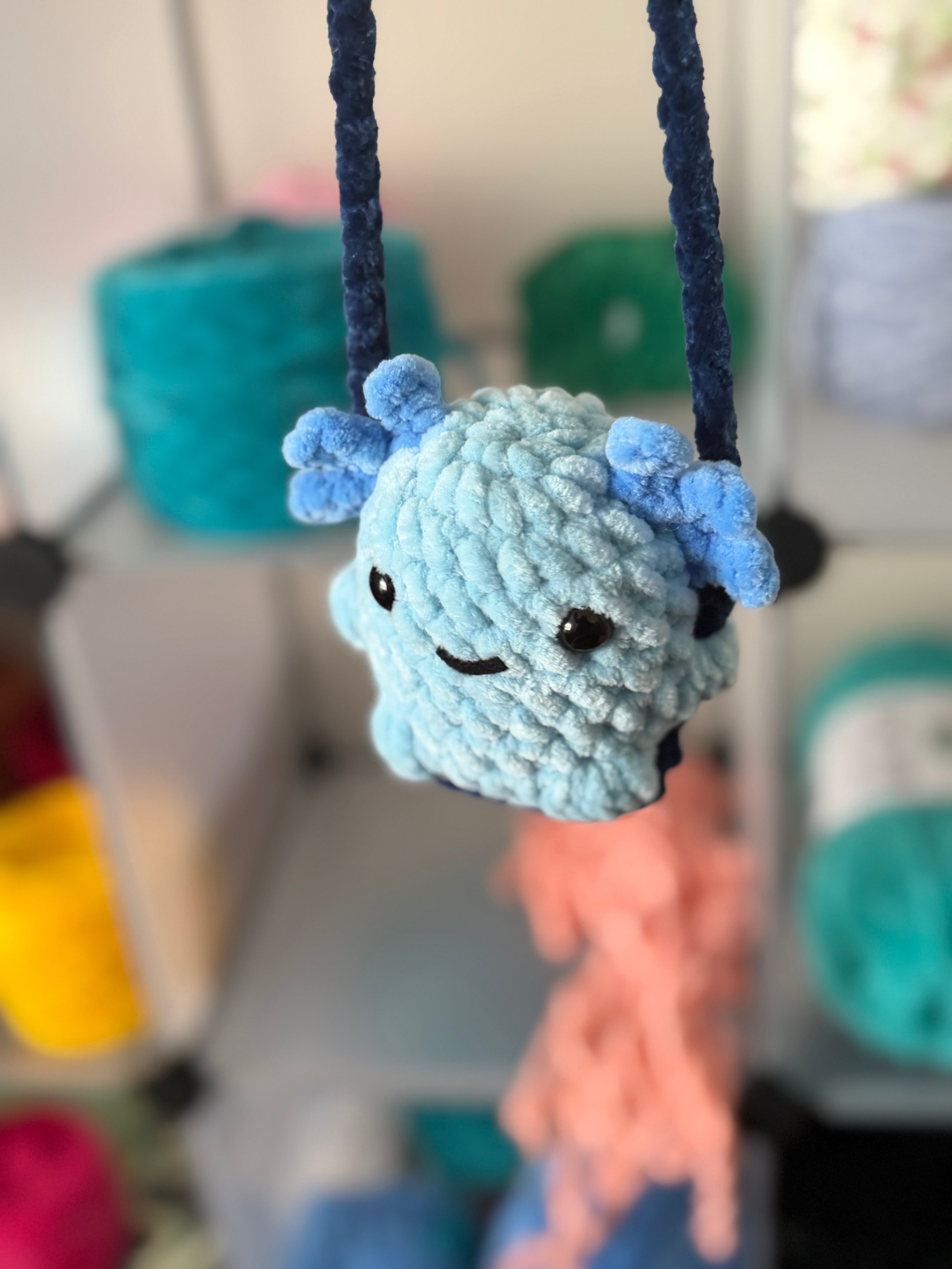 Blue axolotl car swing