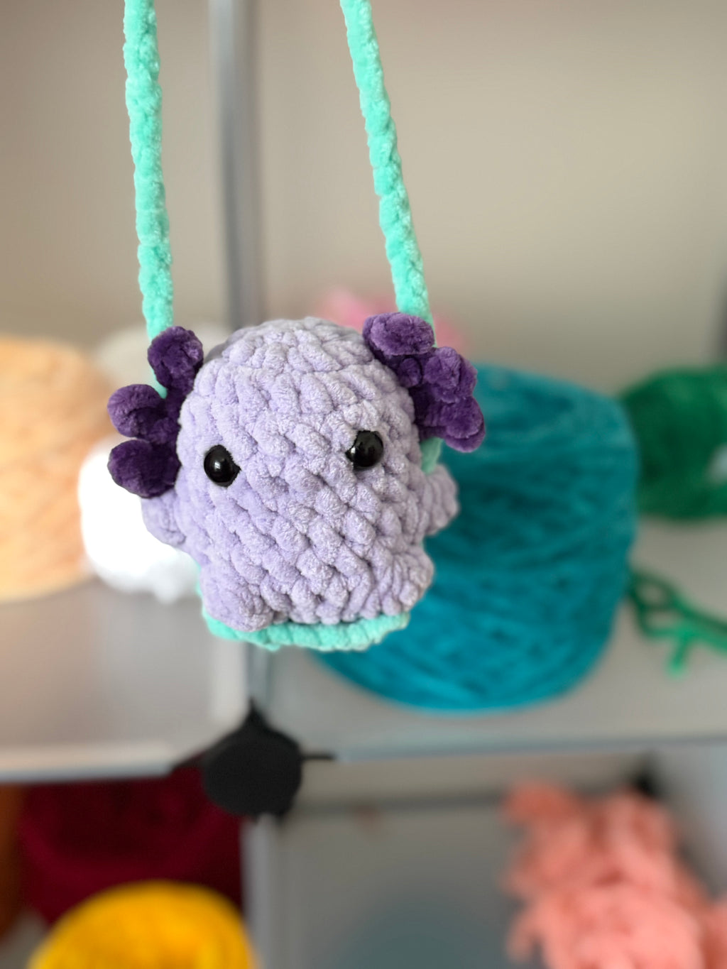 Purple axolotl car swing